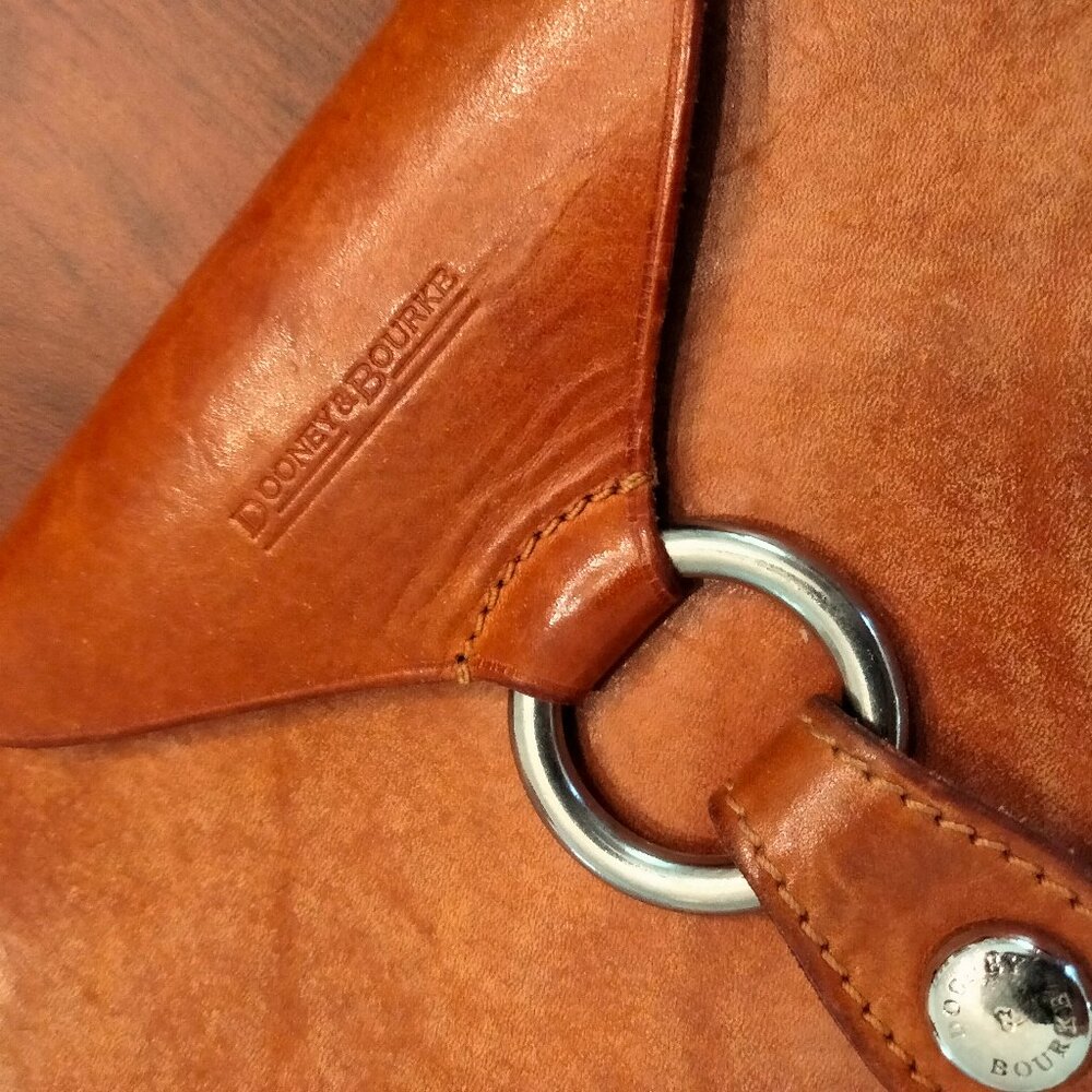 Dooney & Bourke saddle leather bag with brass trim